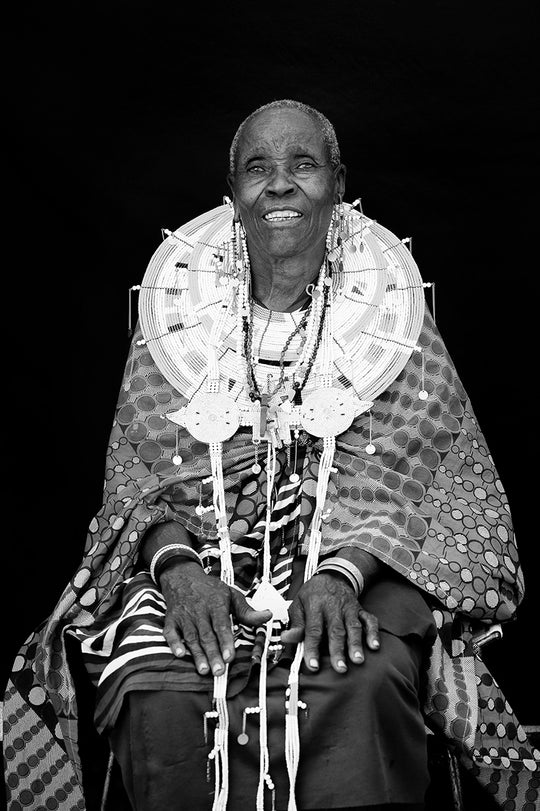 Portrait of Koko Sadera, Maasai grandmother wearing traditional beaded work and disc. 