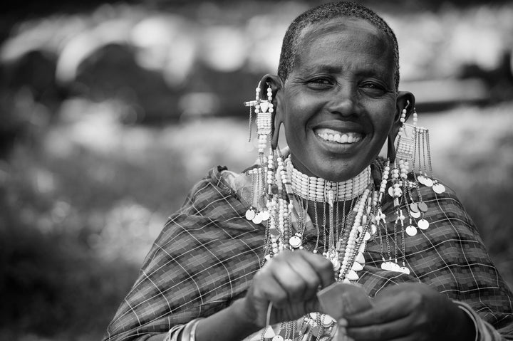 Maasai artisan repairing jewelry at Sidai Designs