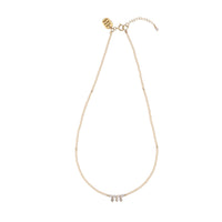 Utulivu Necklace & Mini Pearl Huggies Earrings