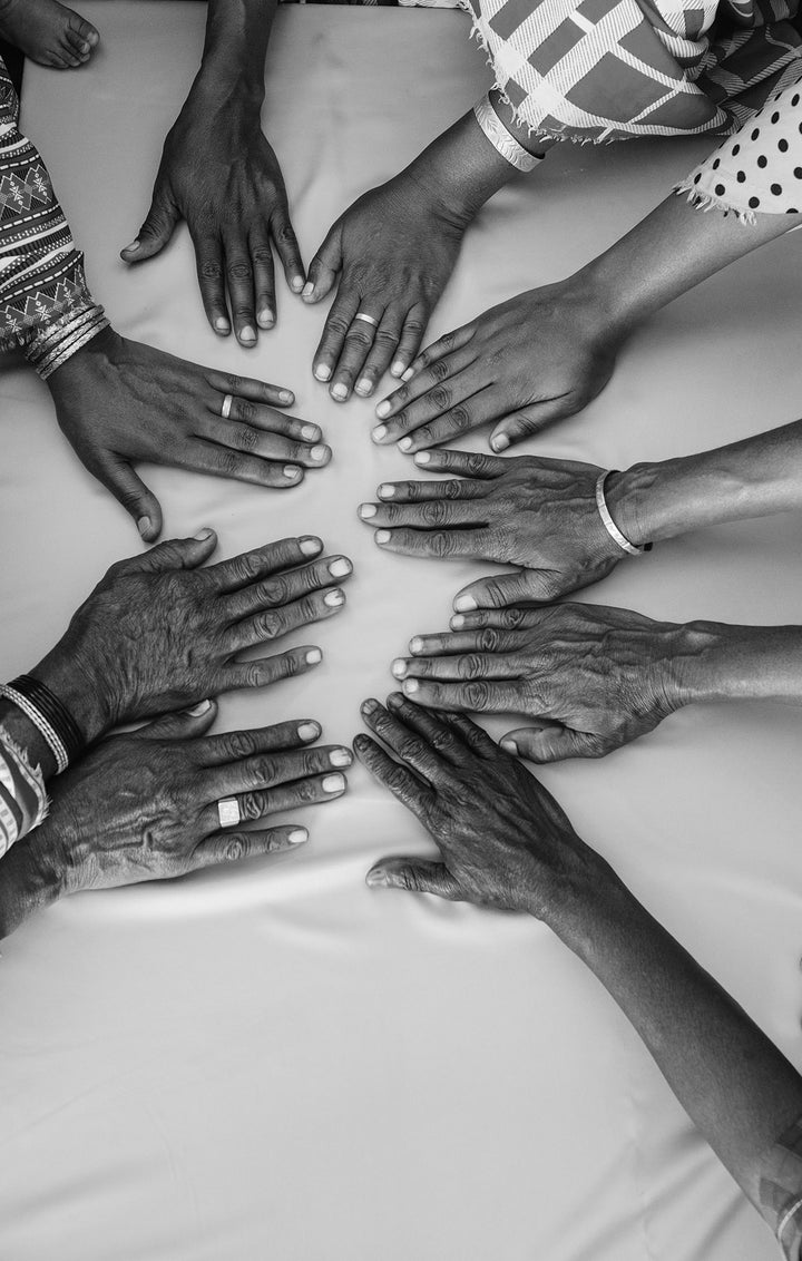 Many Maasai hands of a tribe