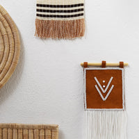 Homeware_Beaded Leather Wall Hanging Handmade by Maasai women. Featured here with People of the Suns natural mask.
