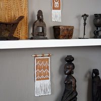 Homeware_ Maasai beaded zig zag wall hanging. Embroidered leather in white beads. Shot at Design Afrika.